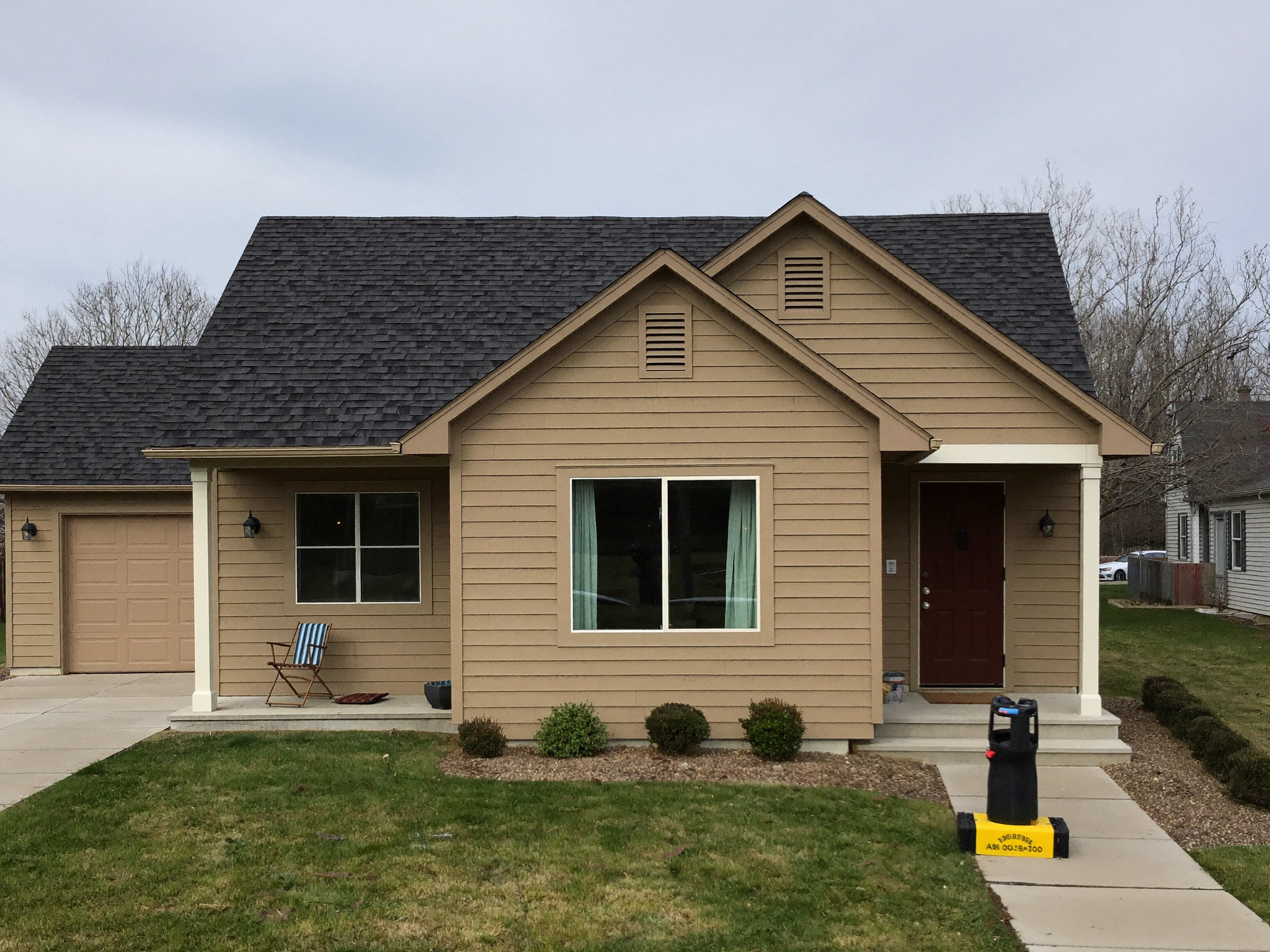 New charcoal shingle roof on a single-story home